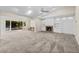 Open living room with a fireplace, built-in shelves, and pool view at 230 W Spring Lake Dr, Altamonte Springs, FL 32714