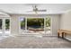 Living area with a large window overlooking the pool and patio at 230 W Spring Lake Dr, Altamonte Springs, FL 32714
