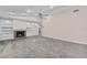 Spacious living room with a fireplace, built in shelving and carpeting at 230 W Spring Lake Dr, Altamonte Springs, FL 32714