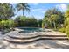 Inviting kidney-shaped pool and spa with spacious patio at 230 W Spring Lake Dr, Altamonte Springs, FL 32714