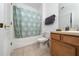 Clean bathroom with shower/tub combo, toilet and wood vanity at 2394 Caravelle Cir, Kissimmee, FL 34746