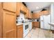 Modern kitchen featuring ample cabinetry and white appliances at 2394 Caravelle Cir, Kissimmee, FL 34746