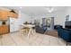 Open kitchen with light cabinets, breakfast bar, and living area view at 2394 Caravelle Cir, Kissimmee, FL 34746