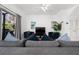 Relaxing living room, featuring a comfortable sofa and view of the kitchen at 2394 Caravelle Cir, Kissimmee, FL 34746