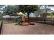 Community playground with slides and climbing structure at 2394 Caravelle Cir, Kissimmee, FL 34746