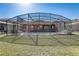Spacious backyard featuring a screened pool and patio at 334 Orange Cosmos Blvd, Davenport, FL 33837
