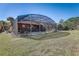 Enjoy the large backyard with a beautiful screened-in pool at 334 Orange Cosmos Blvd, Davenport, FL 33837