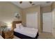 Twin bedroom with wood furniture and ceiling fan at 334 Orange Cosmos Blvd, Davenport, FL 33837