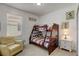 Bedroom with bunk beds and Mickey Mouse decor at 334 Orange Cosmos Blvd, Davenport, FL 33837