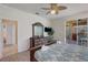 Main bedroom with king bed, dresser, and patio access at 334 Orange Cosmos Blvd, Davenport, FL 33837