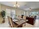 Elegant dining room with a large table and chandelier at 334 Orange Cosmos Blvd, Davenport, FL 33837