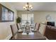 Formal dining area with glass-top table and seating for six at 334 Orange Cosmos Blvd, Davenport, FL 33837