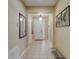 Bright and spacious entryway with tile flooring and a coat rack at 334 Orange Cosmos Blvd, Davenport, FL 33837