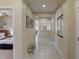 Clean and bright hallway with tile floors and mirror at 334 Orange Cosmos Blvd, Davenport, FL 33837