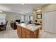 Open concept kitchen and Gathering room with breakfast bar and island at 334 Orange Cosmos Blvd, Davenport, FL 33837