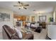 Open concept living room and kitchen with tile floors at 334 Orange Cosmos Blvd, Davenport, FL 33837