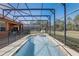 Private screened pool and spa with a spacious deck for lounging at 334 Orange Cosmos Blvd, Davenport, FL 33837