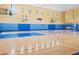 Indoor basketball court with multiple hoops and blue accents at 3406 Soho St # B6, Orlando, FL 32835