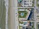 Aerial view showing building, pool, and beach access at 3663 S Atlantic Ave # 11D, New Smyrna Beach, FL 32169