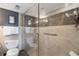 Clean bathroom with walk-in shower and granite vanity at 3663 S Atlantic Ave # 11D, New Smyrna Beach, FL 32169