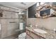 Bathroom boasts granite vanity and a walk-in shower at 3663 S Atlantic Ave # 11D, New Smyrna Beach, FL 32169