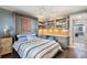 Multi-functional bedroom with a Murphy bed and built-in shelves at 3663 S Atlantic Ave # 11D, New Smyrna Beach, FL 32169