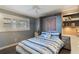 Cozy bedroom with built-in shelves and Murphy bed at 3663 S Atlantic Ave # 11D, New Smyrna Beach, FL 32169