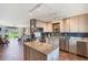 Bright kitchen features granite countertops, stainless steel appliances, and an island at 3663 S Atlantic Ave # 11D, New Smyrna Beach, FL 32169