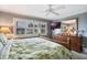 Bright bedroom with large windows, dresser and a king bed at 3663 S Atlantic Ave # 11D, New Smyrna Beach, FL 32169