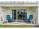 Covered patio with comfortable seating at 3663 S Atlantic Ave # 11D, New Smyrna Beach, FL 32169
