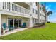 Ground level patio with seating and ocean views at 3663 S Atlantic Ave # 11D, New Smyrna Beach, FL 32169