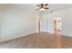 Large bedroom with tile floors and access to a bathroom and patio at 389 Mohave Terrace, Lake Mary, FL 32746