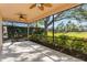 Relaxing screened porch overlooking a lush green backyard at 389 Mohave Terrace, Lake Mary, FL 32746