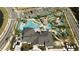 Aerial view of resort-style pool, clubhouse, and amenities at 4355 Scene Ln, Kissimmee, FL 34746