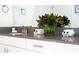 Modern bathroom with dark countertop and white cabinets at 4355 Scene Ln, Kissimmee, FL 34746
