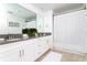 Double vanity bathroom with a walk-in shower and neutral color scheme at 4355 Scene Ln, Kissimmee, FL 34746