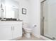 Clean bathroom with white vanity, toilet and shower stall at 4355 Scene Ln, Kissimmee, FL 34746