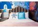 Frozen-themed bedroom with twin beds and snowflake pillows at 4355 Scene Ln, Kissimmee, FL 34746