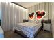Charming bedroom with a Mickey and Minnie Mouse-themed headboard and a gray bed at 4355 Scene Ln, Kissimmee, FL 34746