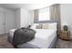 Spacious bedroom with king-size bed, soft color palette, and ample natural light at 4355 Scene Ln, Kissimmee, FL 34746