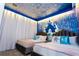 Two twin beds in a themed bedroom with castle wall art and snowflake accents at 4355 Scene Ln, Kissimmee, FL 34746
