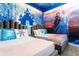 Frozen-themed bedroom with twin beds and mural at 4355 Scene Ln, Kissimmee, FL 34746