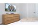 Bedroom featuring a dresser and mounted TV, creating a functional space at 4355 Scene Ln, Kissimmee, FL 34746