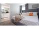 Bedroom with a king-size bed, en-suite bathroom, and neutral decor at 4355 Scene Ln, Kissimmee, FL 34746