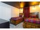 Two twin beds in a rustic-themed bedroom with brick accent wall at 4355 Scene Ln, Kissimmee, FL 34746