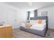 Bedroom with king-size bed and neutral decor, creating a calming atmosphere at 4355 Scene Ln, Kissimmee, FL 34746