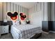 Mickey and Minnie Mouse-themed bedroom with a comfortable bed and ample closet space at 4355 Scene Ln, Kissimmee, FL 34746