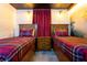 Two twin beds in a Hogwarts-themed bedroom with mural at 4355 Scene Ln, Kissimmee, FL 34746