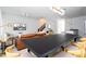 Modern dining area with a large black table and light wood chairs at 4355 Scene Ln, Kissimmee, FL 34746