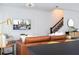 Living room with leather sofa and black kitchen island at 4355 Scene Ln, Kissimmee, FL 34746